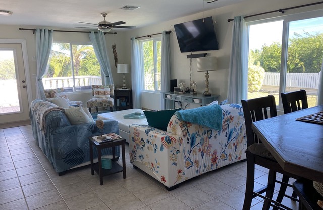 Modern vacation home with private yard, steps to the beach and centrally located