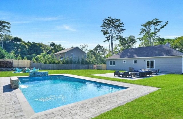 Newly built ranch, beautifully landscaped with pool, large yard, patio,.