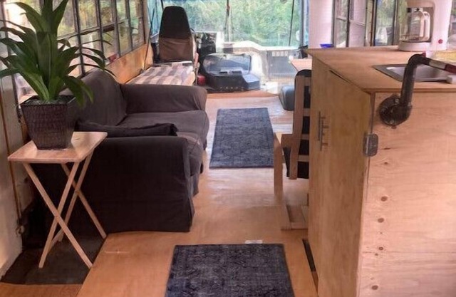 Newly converted 3-season bus. Outdoor shower.n