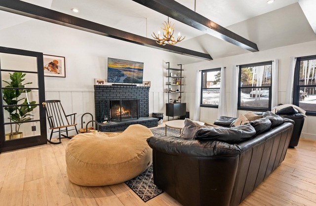 Nostalgic vibe with modern amenities in midcentury log cabin with hot tub + more