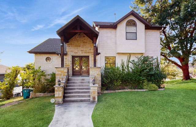 Opulent waterfront home with dock, firepit & stunning river view