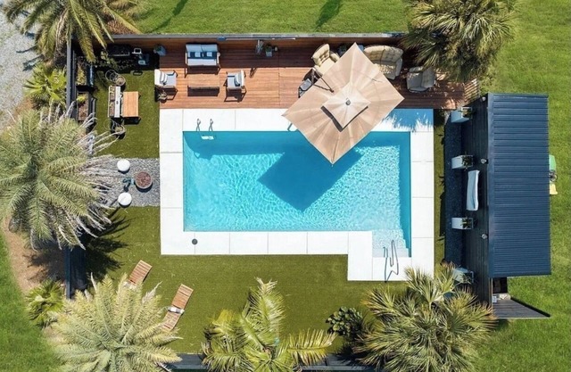 Organically Designed Spacious Home w/a Resort Style Heated Pool & Private Dock