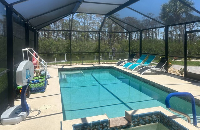Outdoor paradise on waterway with pool and spa, beach gear, and dog friendly