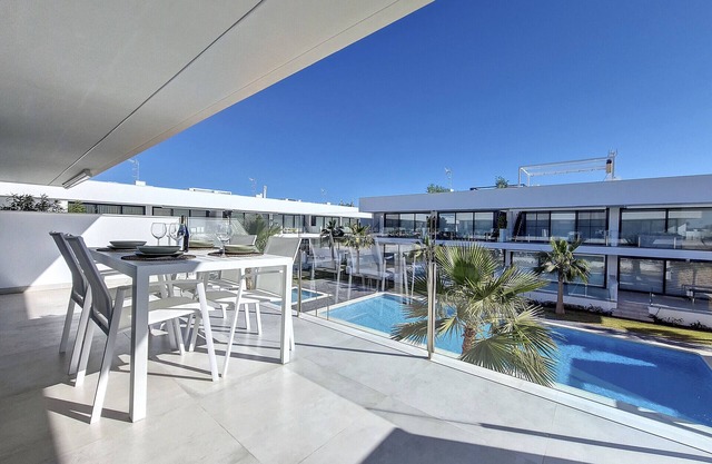 Penthouse with roof terrace and pool views