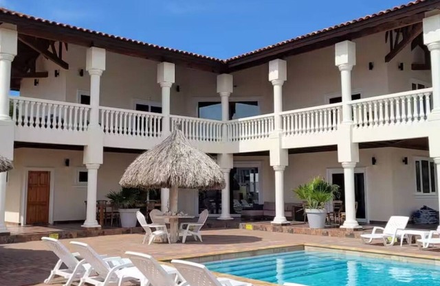 Perched on a hill in Noord, this villa is a 6-bed, 7-bath luxury retreat just minutes from Palm Beach. With 5,500 sq. ft. of indoor comfort plus expansive outdoor living, this private villa blends upscale elegance with island charm.