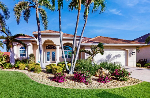 Pet friendly, waterfront house with private pool, lanai, and arcade games