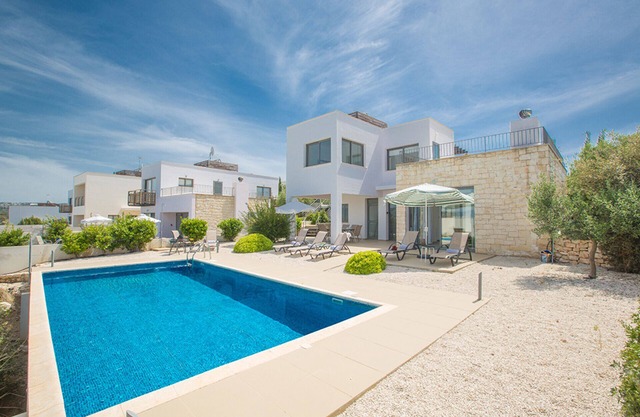 Picture Relaxing Beside Your Private Pool in Your Villa Reading Your Favourite Book