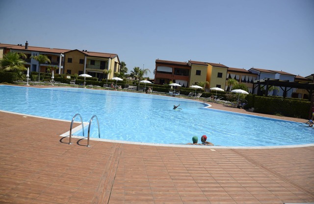 POSEIDONE-Refined apartments in village with swimming pool