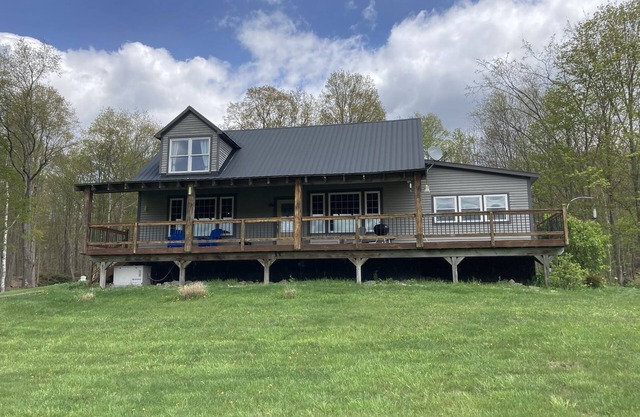 Post/Beam farmhouse with gorgeous views, a hot tub, no cleaning fees and sheep!