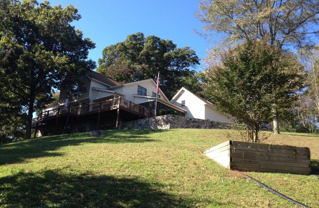 Private country hillside setting surrounded by trees, birds, wildlife pond/falls