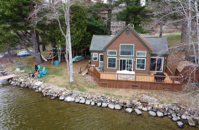 Private waterfront with stunning views, wrap around deck, and a dock for boating