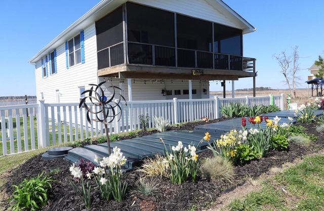 Quiet dog friendly home overlooking nature preserve, 1 block from private beach.