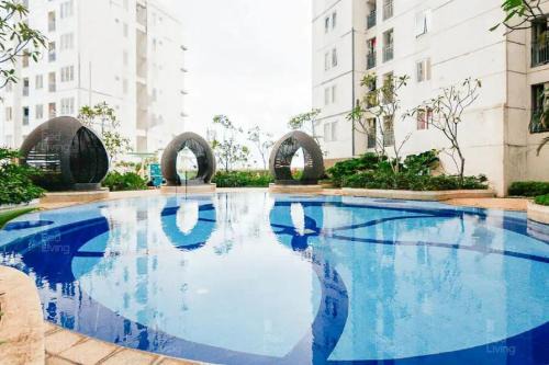 RedLiving Apartemen Bassura City - Byrin Property Tower Heliconia