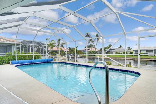 Reduced Rates - Waterfront Heated Pool Home with dock, grill, near Fisherman's Village