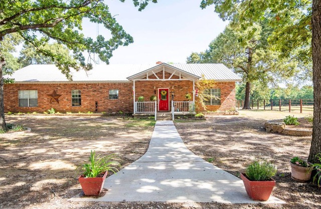Relax and enjoy the peace & quiet at this spacious ranch on 30 plus acres.n