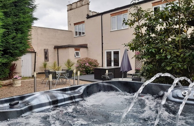 Relax and unwind at our hot tub retreat, close to activities, trails, water park
