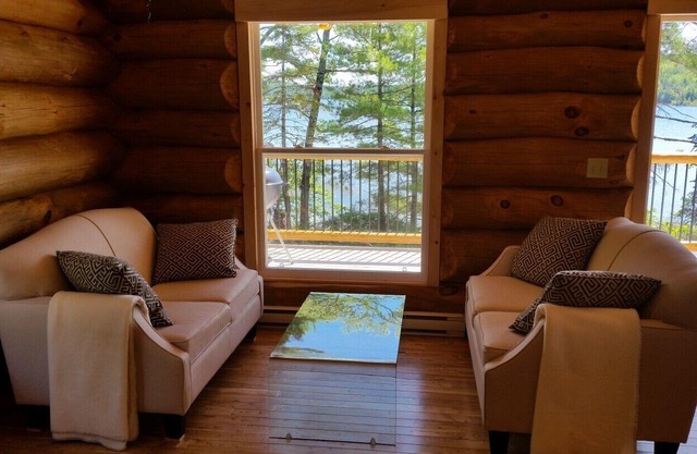 Relax in Canada: a lakeside log cottage near Kejimkujik National Park.