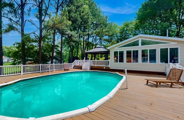 Renovated house with private pool, water access, boat launch, game room & deck