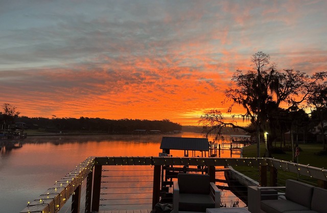 River House w/2-story dock, boat ramp, fire pits outdoor lounge area.