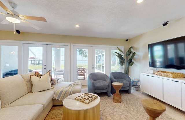 Riverfront House with pool, panoramic views, and covered balcony