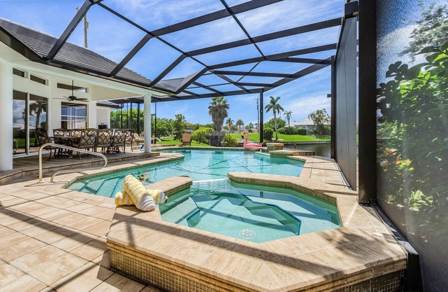 Riverfront Luxury with Heated Pool, Spa & Private Dock – Sunny Shores Escape
