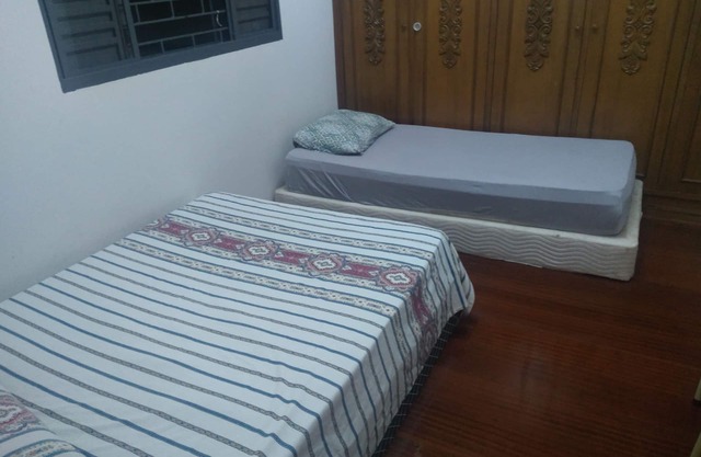 Room with two beds in pensionato in Maringá/pr