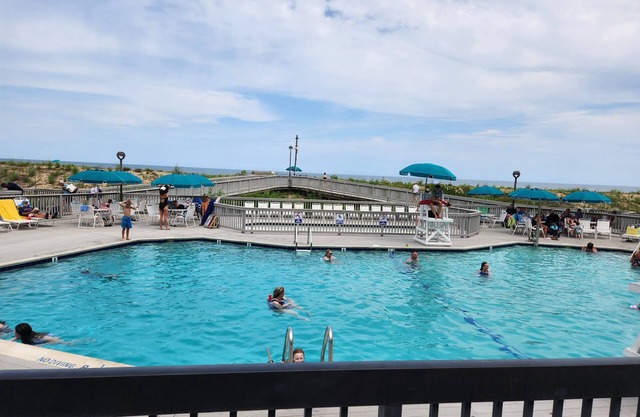 Sea Colony garden condo steps to pool & ocean and only a short walk to town.