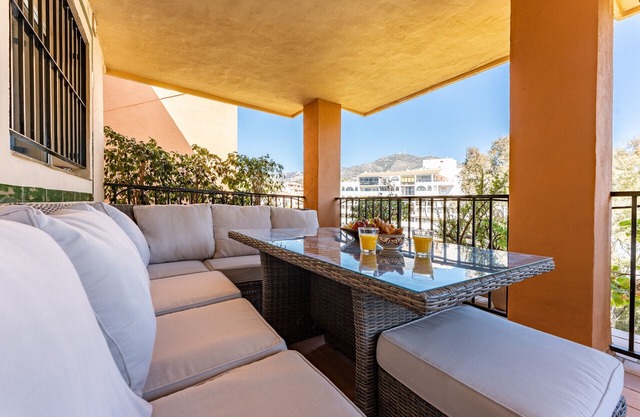 Seaside Bliss: 2BR Apartment with Tranquil Terrace, Pool & Parking