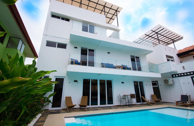 Steps from beach with private pool, rooftop terrace & swim up bar beach club!