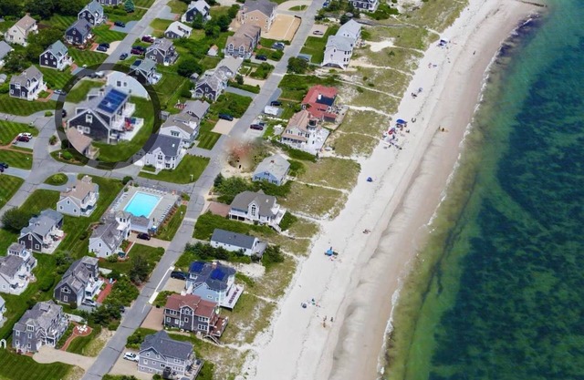 Steps to private beach and pool in coveted GIOC