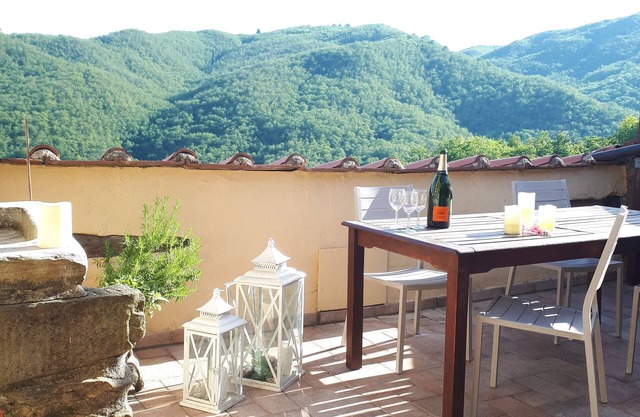 Stone Rustico with garden in an ancient village in Tuscany. View on ancient Pieve