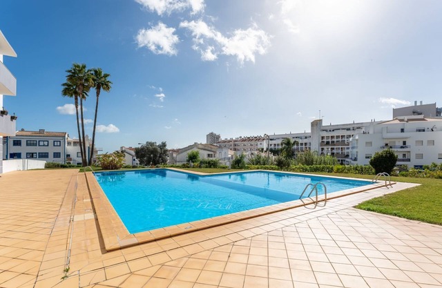 Sunny Retreat w/Pool and Balcony by LovelyStay