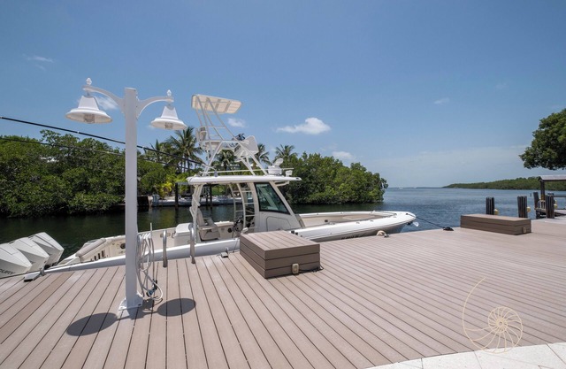 Sunshine Villa | Bayfront apartment with pool, dockage, and sunsets!