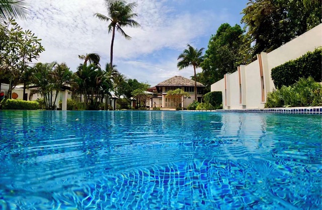 Superb 4 bedroom villa on the beach with a private swimming pool .