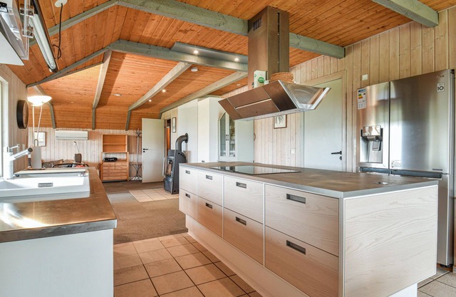 This cozy cottage is located under a romantic thatched roof.