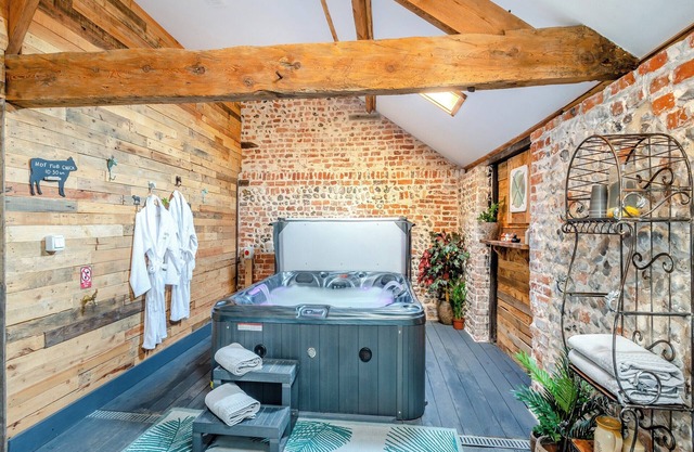 This picture-perfect barn conversion, boasts a private hot tub and sauna.
