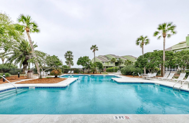 Three-story ocean-view villa with pool, balcony, charcoal grill, & central AC