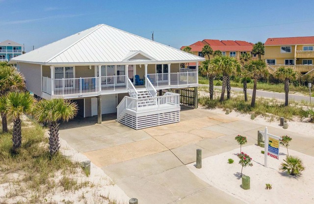 Tranquil covered deck with Gulf views, private pool and easy beach access.