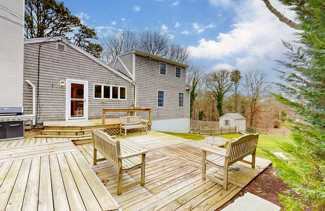 Tranquil & sunlit home with peaceful yard, large deck, & fireplace - near beach