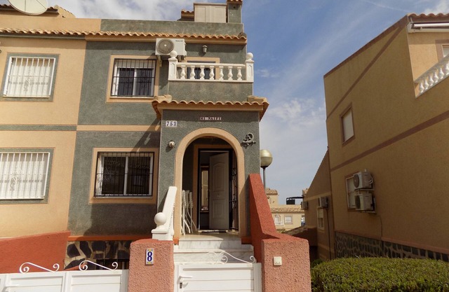 Two bedroom Town house with basement, aircon, communal pool, wifi and sea views