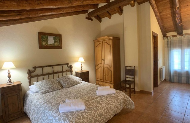 Two spacious mountain houses built with traditional materials.