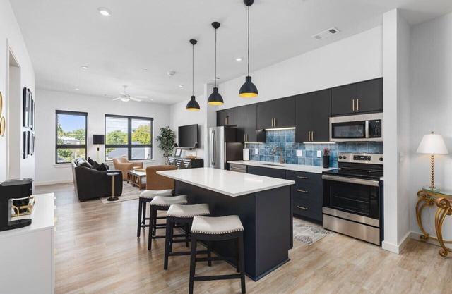 Upscale Music Row Corner Unit with Pool, Patio, Rooftop with City View, & Gym