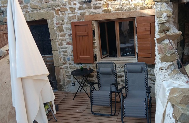 Village house with terrace on pedestrian lane. medieval rural village.