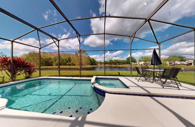 Water view retreat with lanai, heated pool, pool spa, game room, & AC