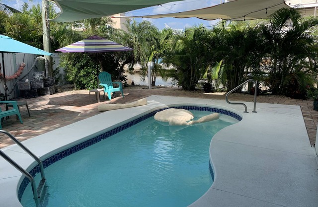 Waterfront, Heated-chilled pool, Outdoor kitchen, downstairs bathroom w/shower!