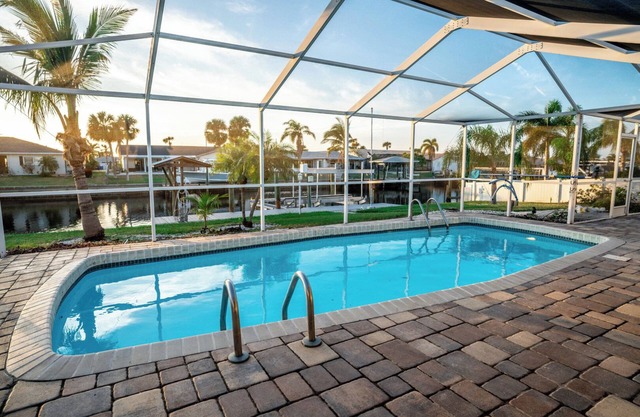Waterfront Oasis with Pool, Spa + Lanai Bar - Simply Blessed