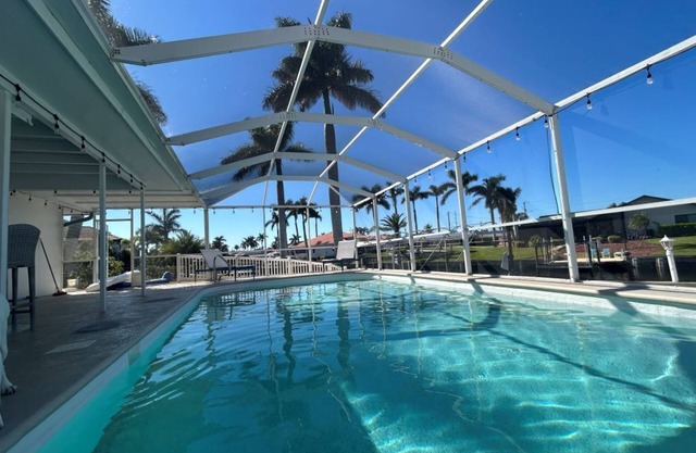 Waterfront, pet-friendly home in sunny SE Cape Coral with WiFi, AC, heated pool