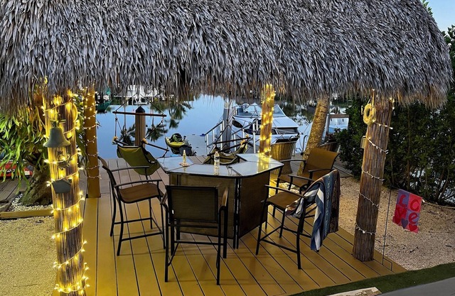 Waterfront Tiny House w Pool, Beach, and Boat Dock