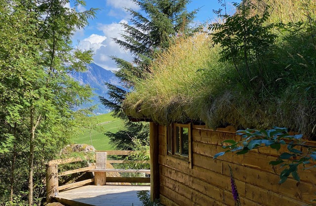 Wooden cabin with grass roof, sleeps 2-5 people., Self catering. Open fire place