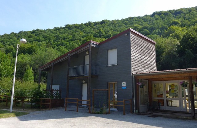 Wooden house by the canal with terrace and games
